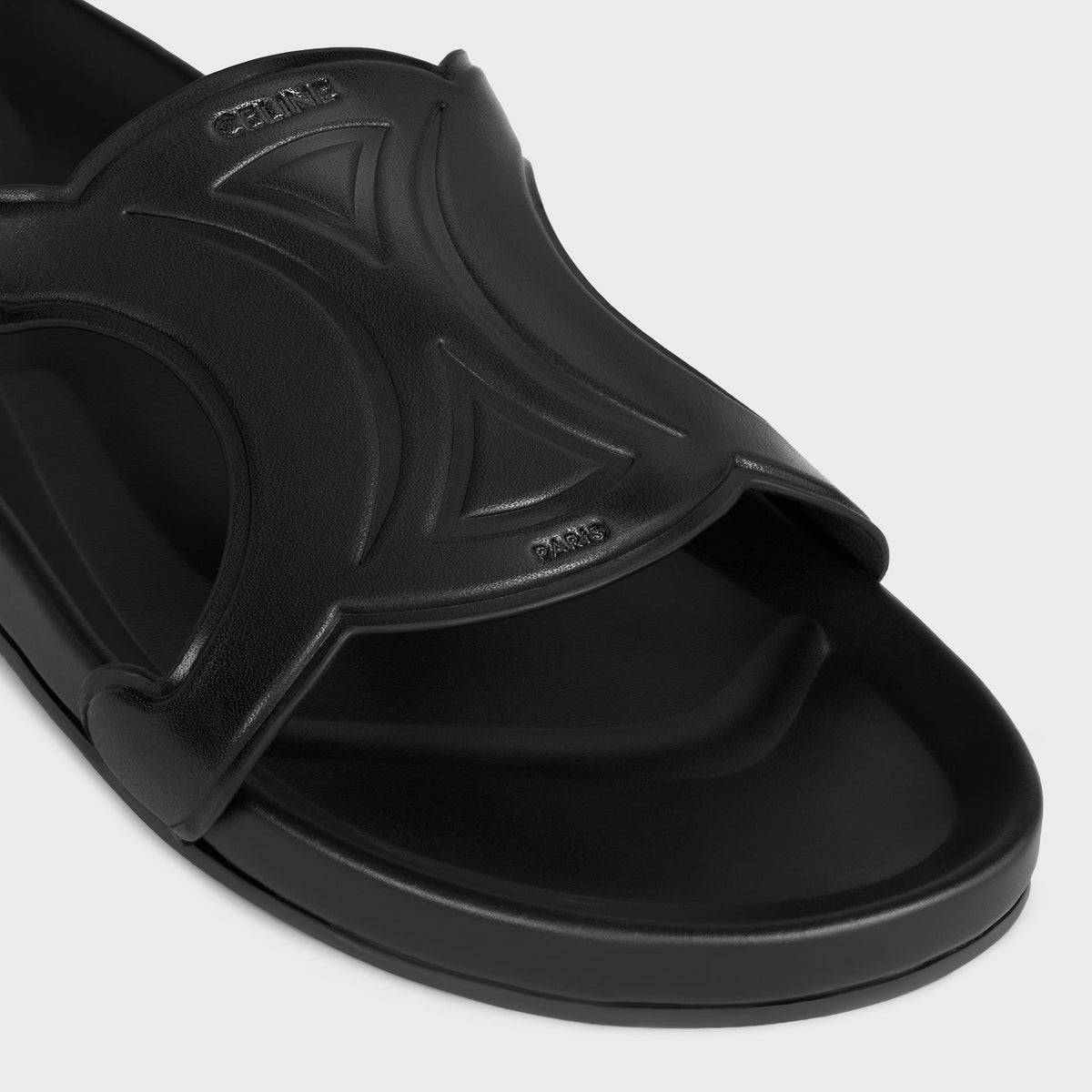 Triomphe slides in vegetable-tanned calfskin in Black
