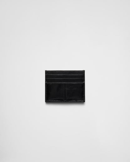 Black leather card holder with triangular logo