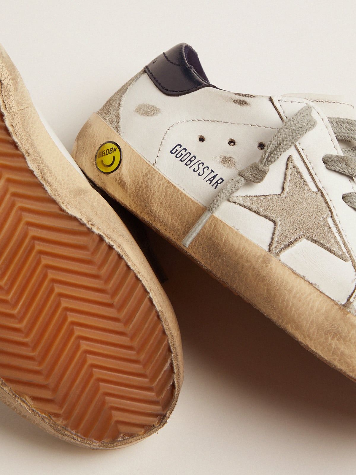 Young superstar with suede star