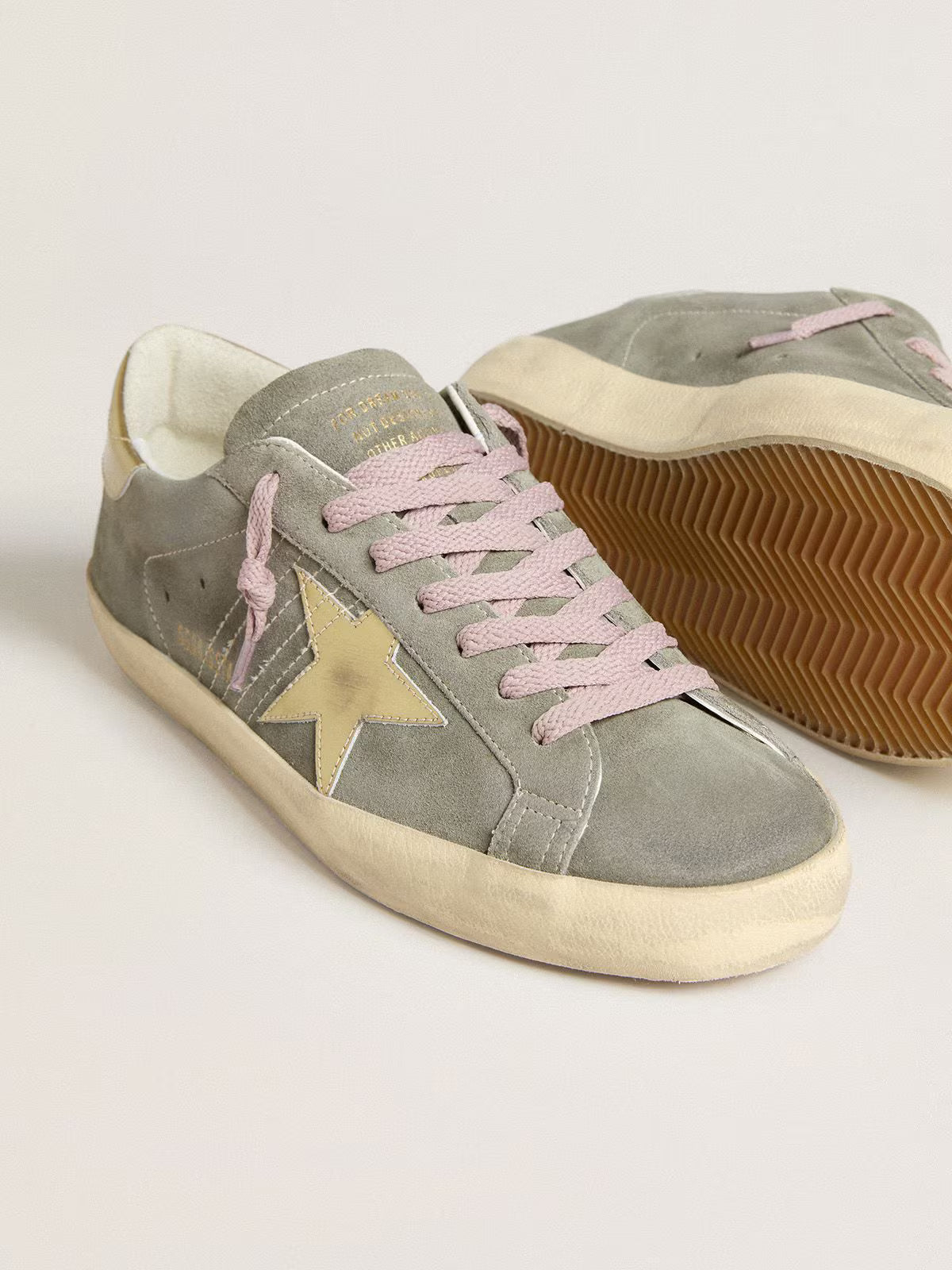 Grey suede with star and heel in golden metallic leather