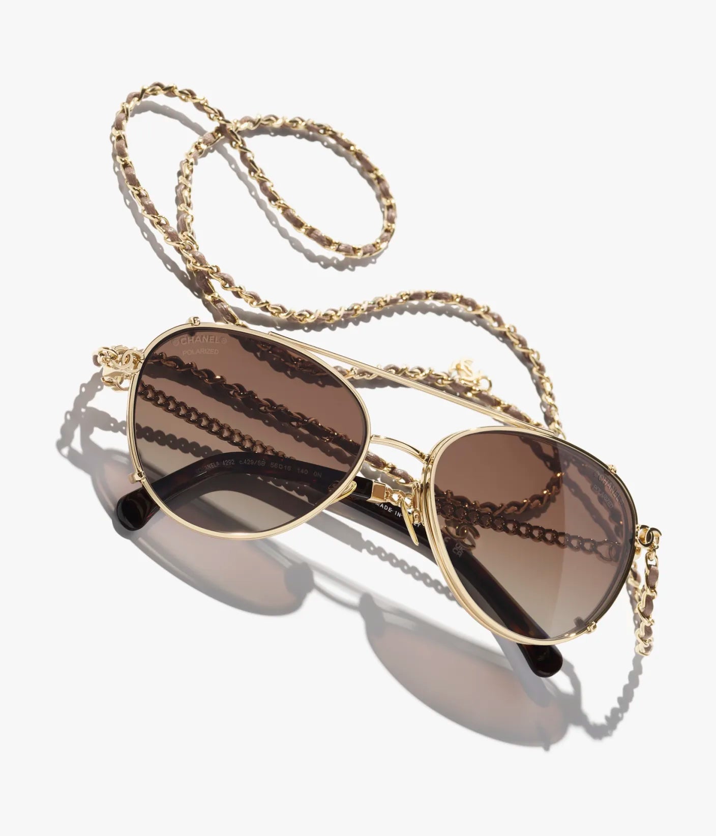 Pilot-Sonnenbrille aus hellgoldfarbenem Metall und Kalbsleder mit braunen Gläsern