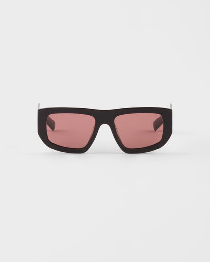 Sonnenbrille mit Dreieckslogo und zigarrenfarbenen Gläsern