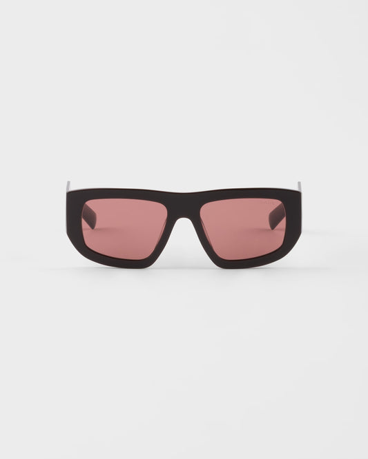 Sunglasses with triangle logo and cigar-colored lenses