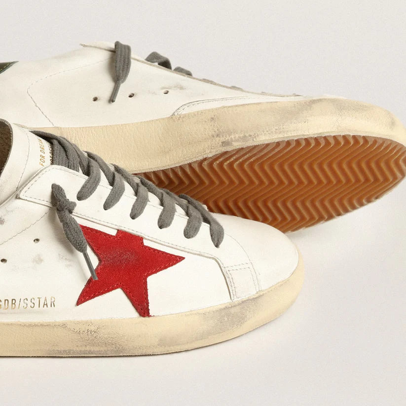 Red suede star and green leather on the heel