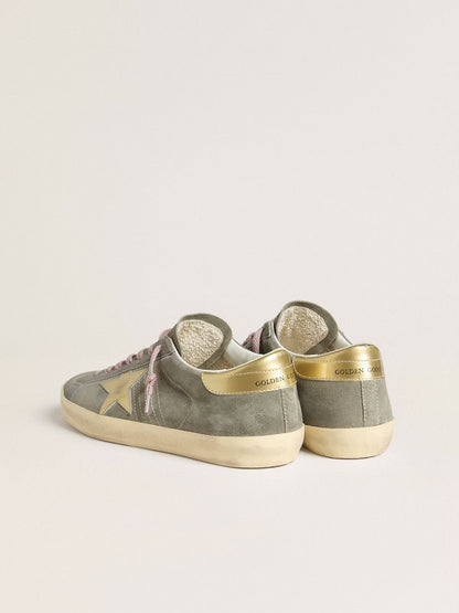 Grey suede with star and heel in golden metallic leather