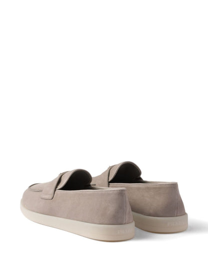 Beige suede slipper with triangle logo