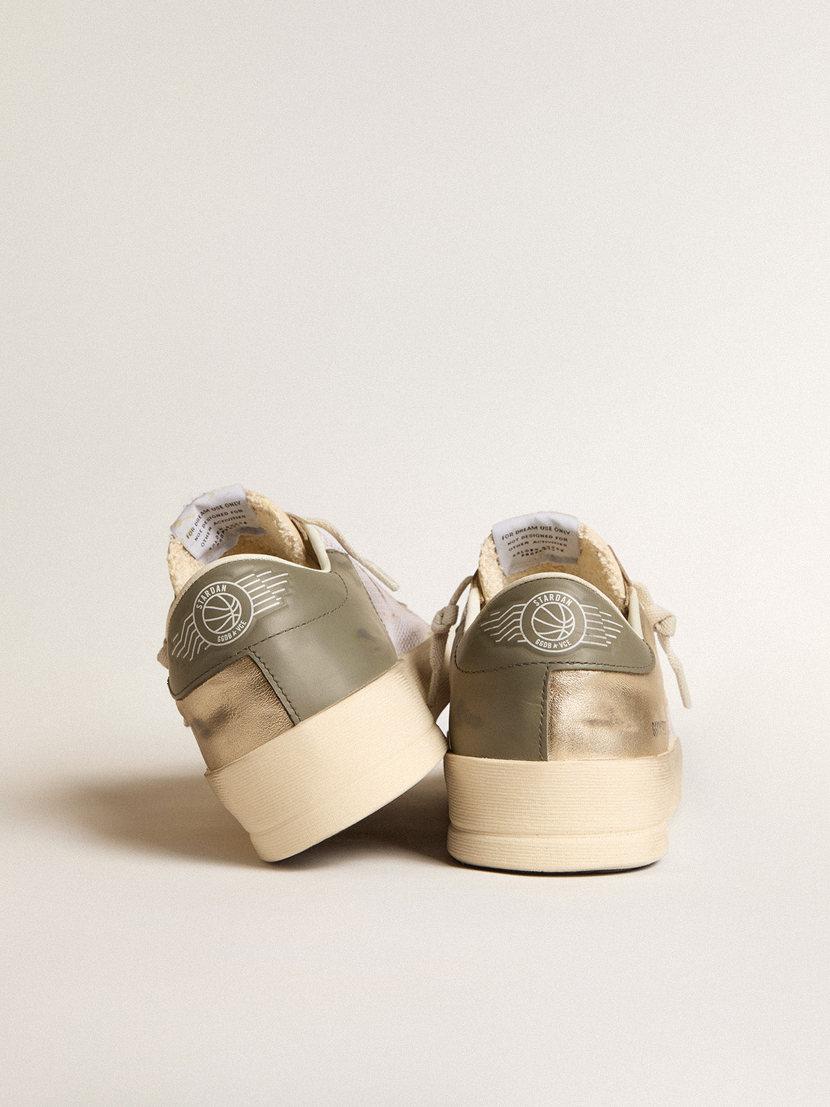 Stardan in white mesh with orange star and platinum leather details