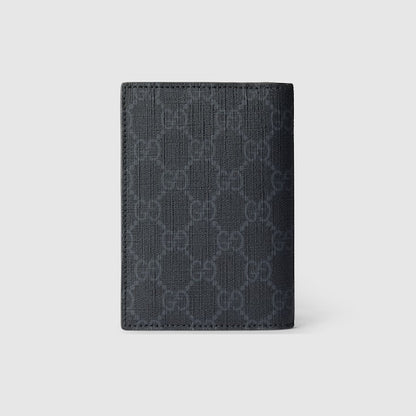 GG passport cover with grey lining made of black GG Supreme fabric
