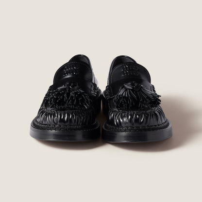 Black brushed leather loafers with tassels