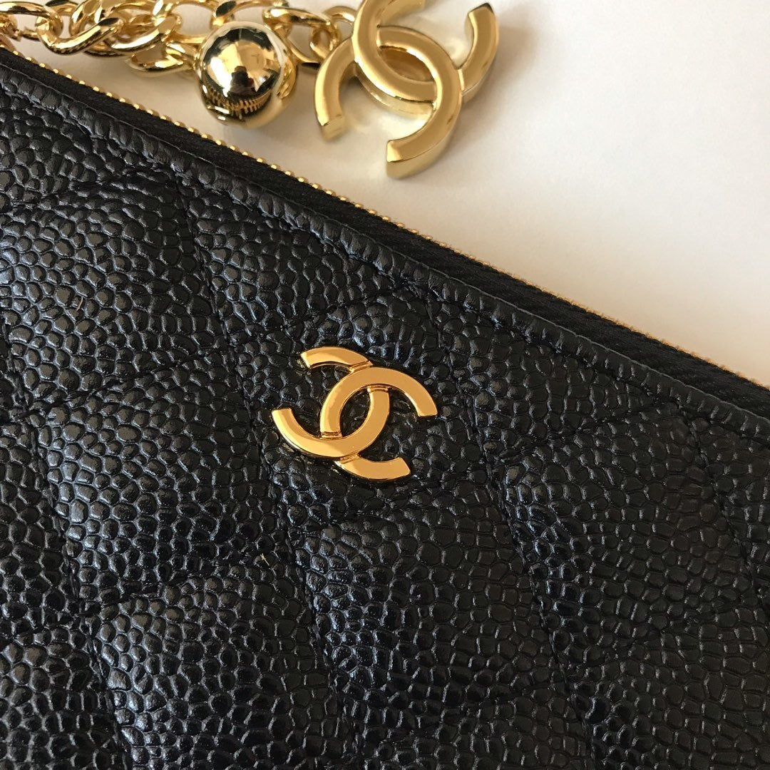 Quilted black leather coin purse with CC logo and gold-tone metal details