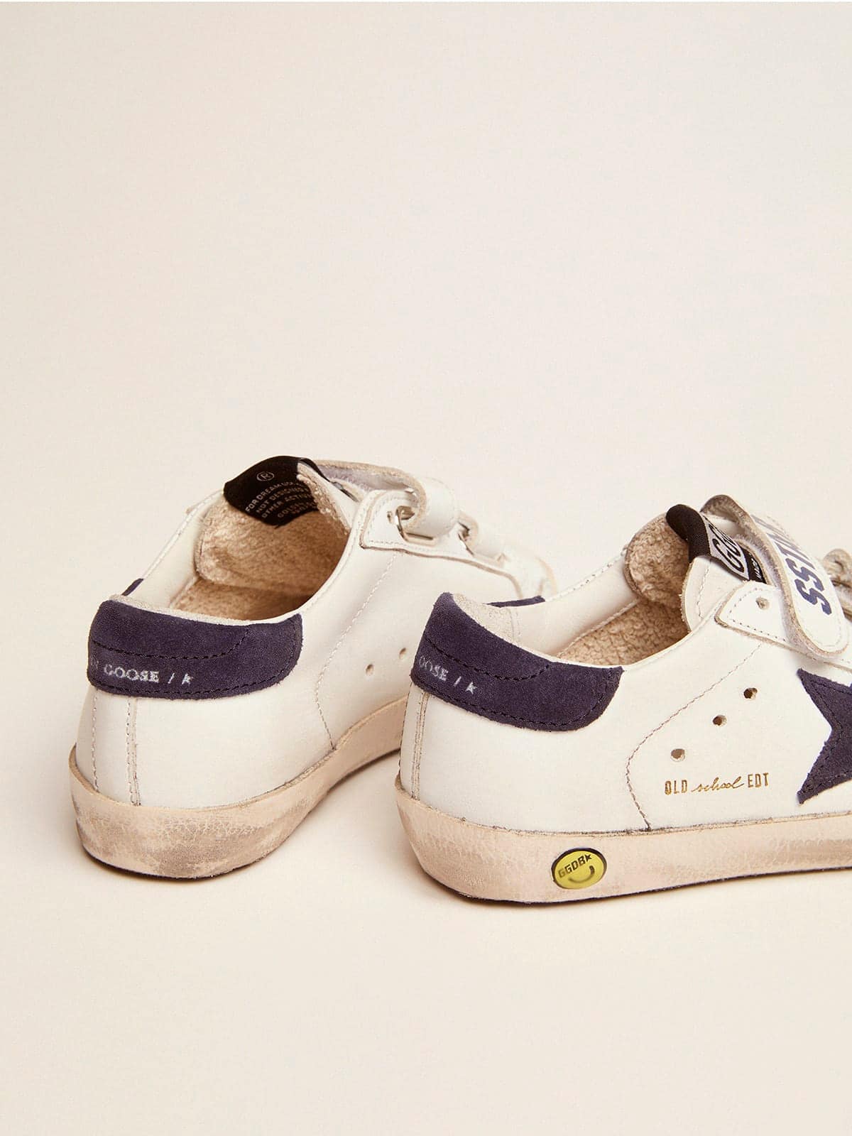 Old School Young in white leather with star and heel detail in blue suede
