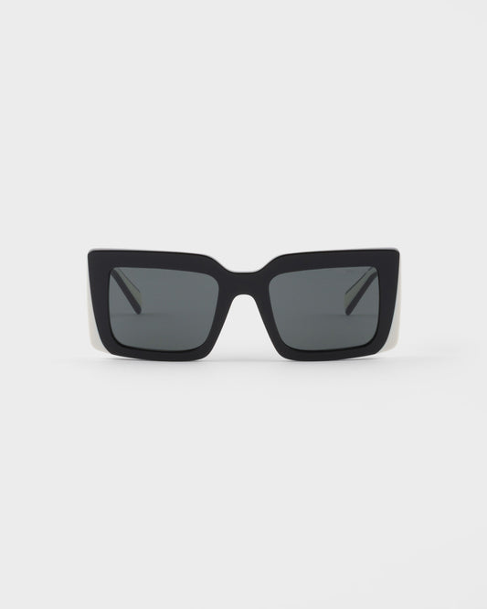 Oversized rectangular sunglasses with a black logo