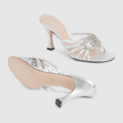 Women's heeled slider sandals with GG criss-cross straps and crystals in silver leather