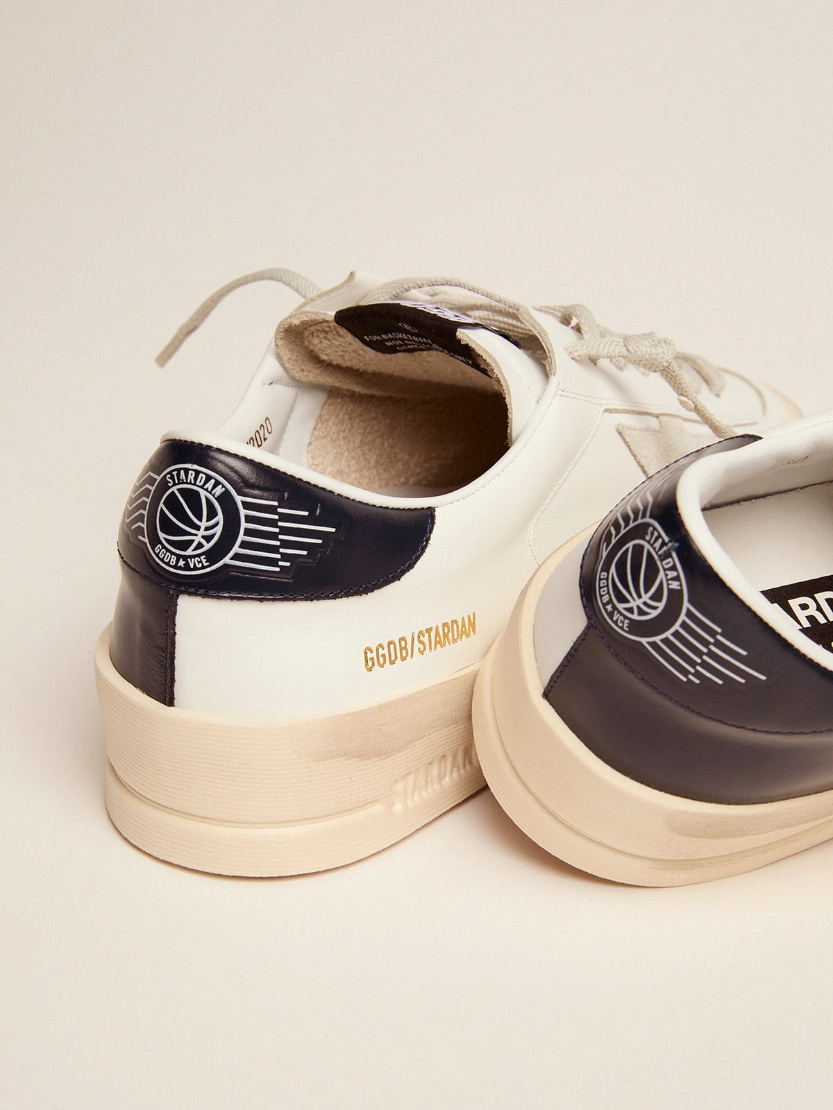 Stardan with star in ice grey suede and navy blue heel