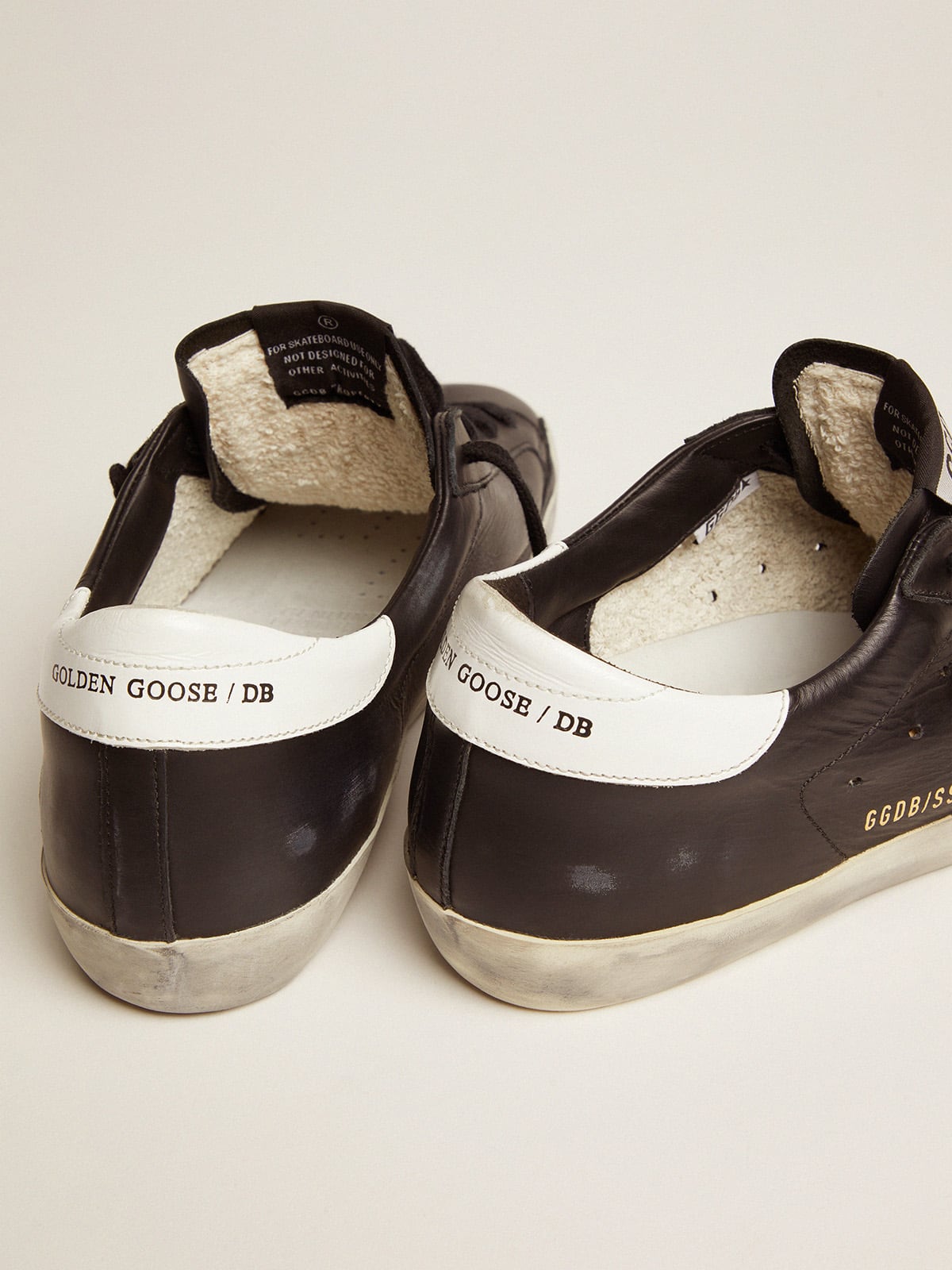 Black leather Super-Star with white leather star and heel