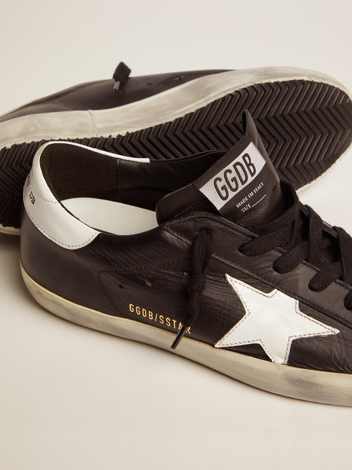 Black leather Super-Star with white leather star and heel