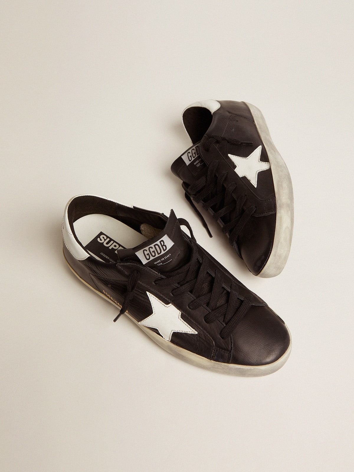 Black leather Super-Star with white leather star and heel