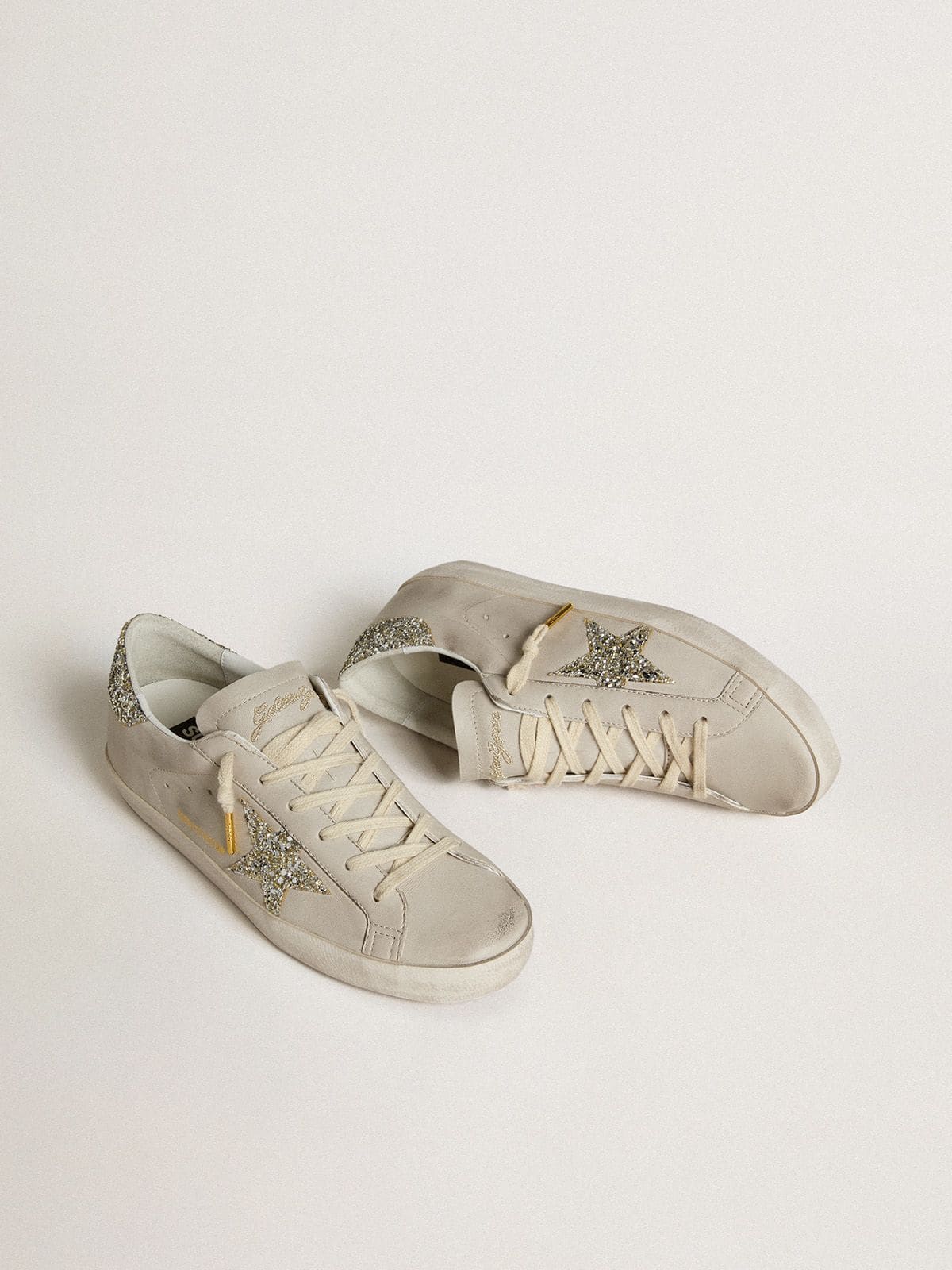 Super-Star LTD in ivory nappa with star and heel in platinum glitter