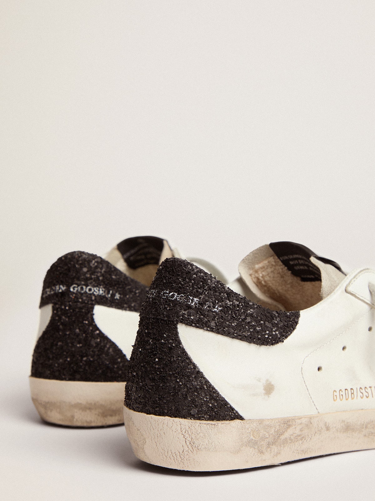 Super-Star made of nappa with a gold glitter star and black glitter on the heel