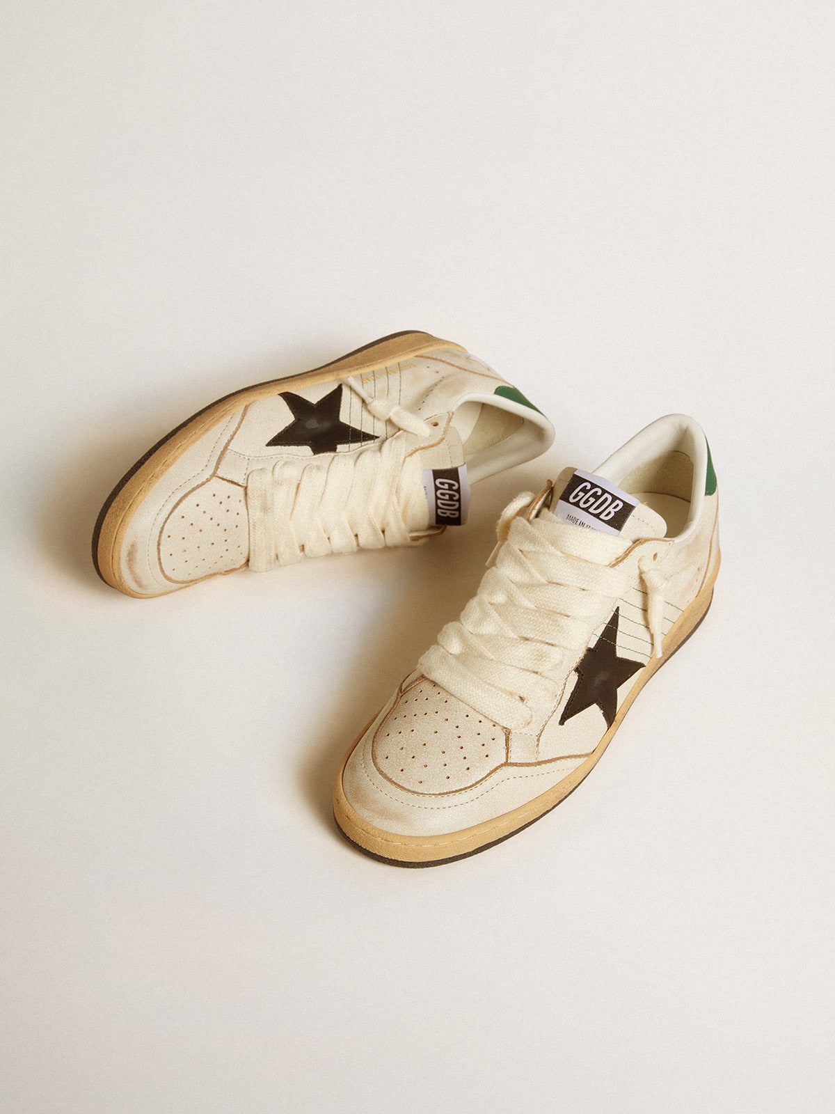 Black leather star and green leather on the heel