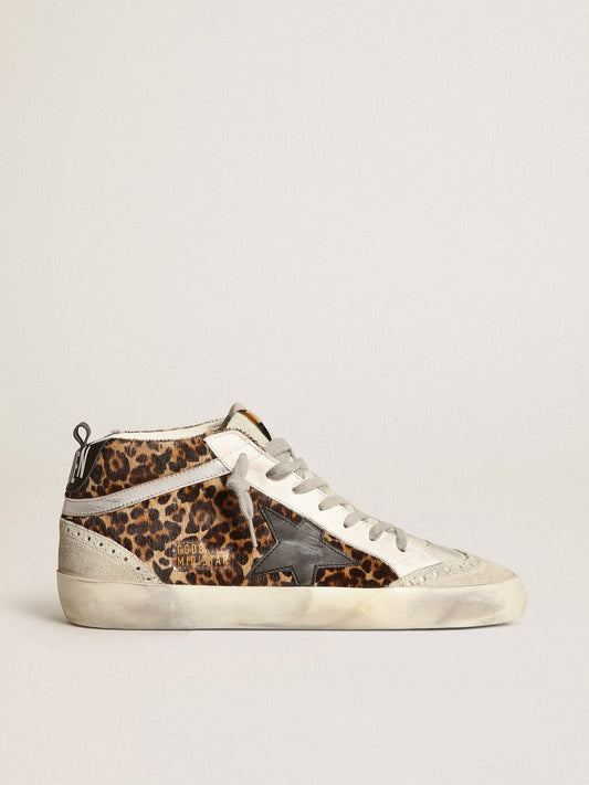 Mid Star made of pony fur with leopard print and black leather star and silver comma