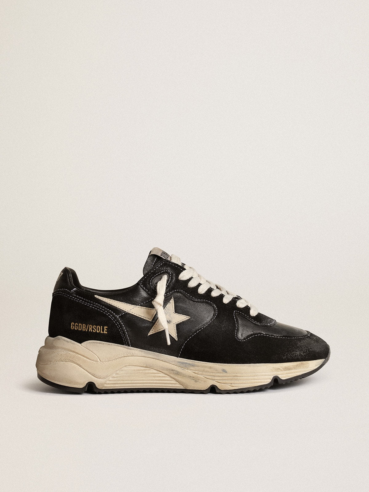 Running sole made of black nappa and suede