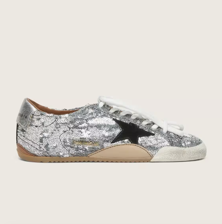 True, made of silver sequins with a black star and silver heel