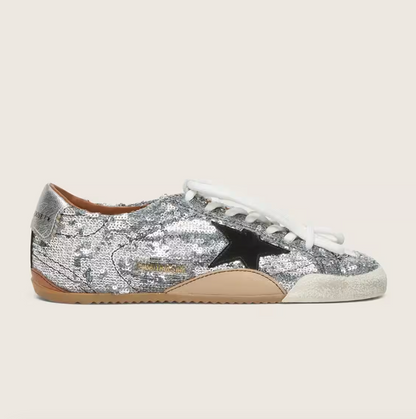 True, made of silver sequins with a black star and silver heel
