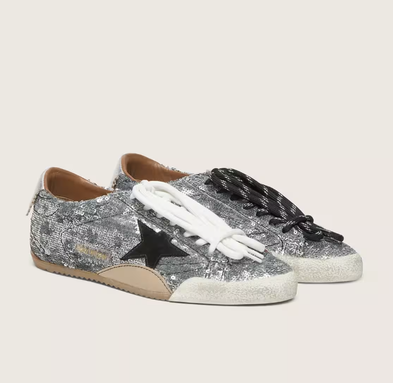 True, made of silver sequins with a black star and silver heel