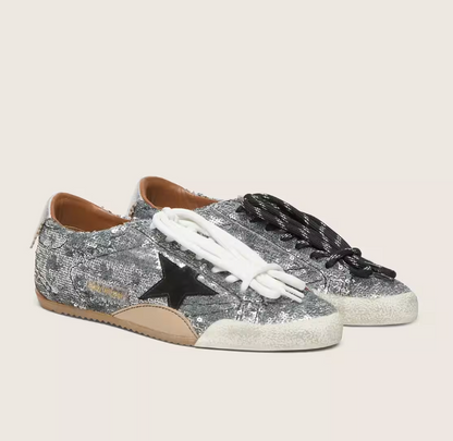 True, made of silver sequins with a black star and silver heel