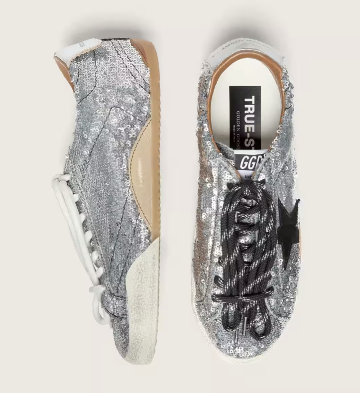 True, made of silver sequins with a black star and silver heel