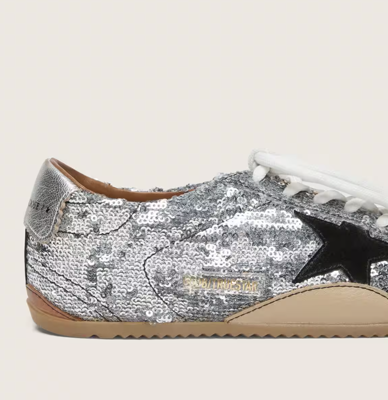 True, made of silver sequins with a black star and silver heel